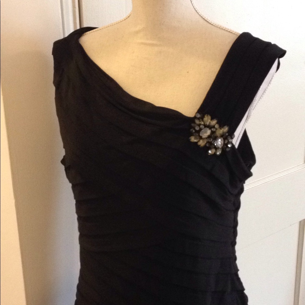 Asymmetrical black cocktail dress.